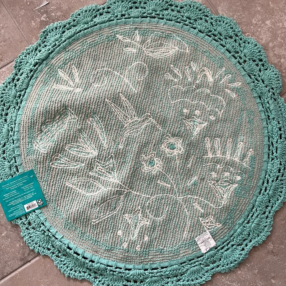 The Pioneer Woman “Mazie” round bath rug.